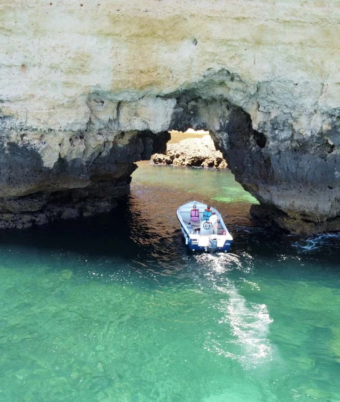Boat crossing a rock